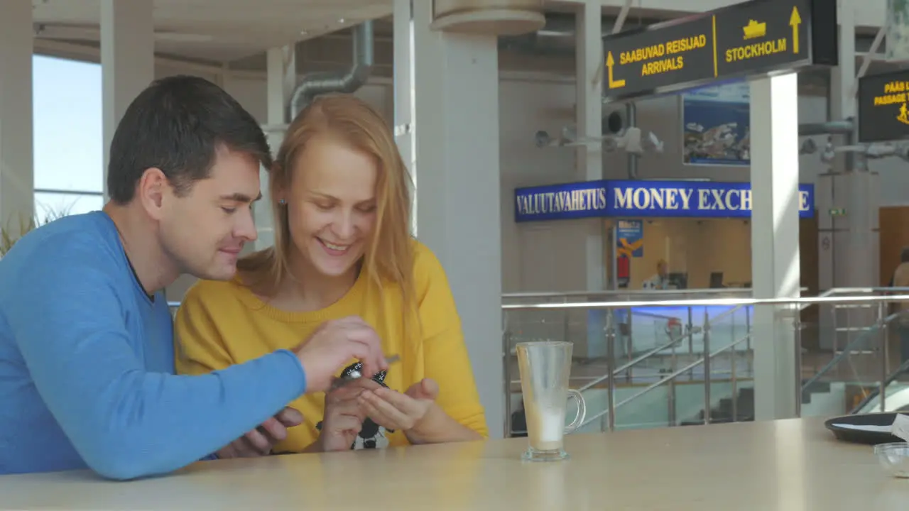 Happy Adult Couple With Smart Phones