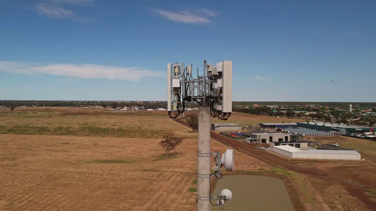 Circle around mobile phone tower with dam and wheat paddocks in the background near Yarrawonga Victoria Australia