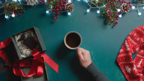 Overhead Shot Of Person With Green Screen Mobile Phone With Christmas Decorations And Gifts 1