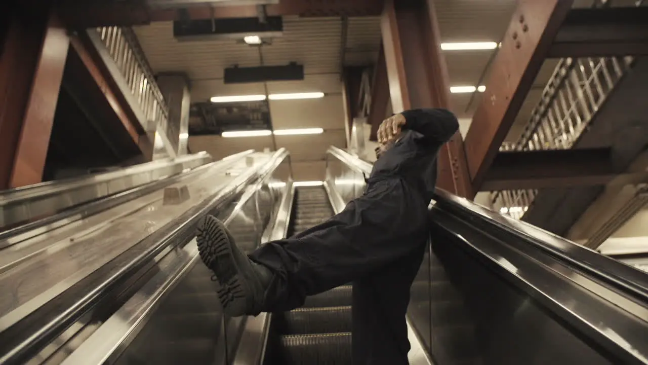 Janitor dancer rides escalator and falls