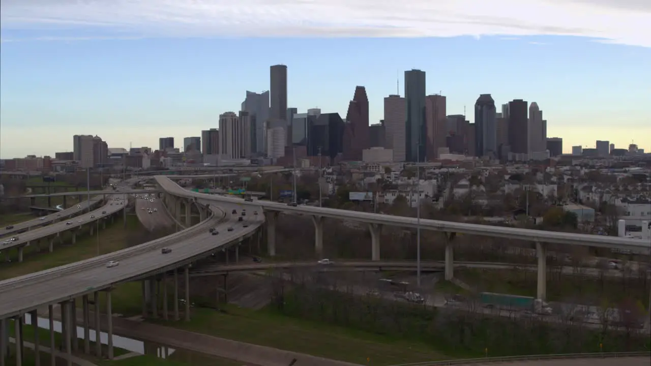 Descending drone shot of downtown Houston Texas and surrounding landscape