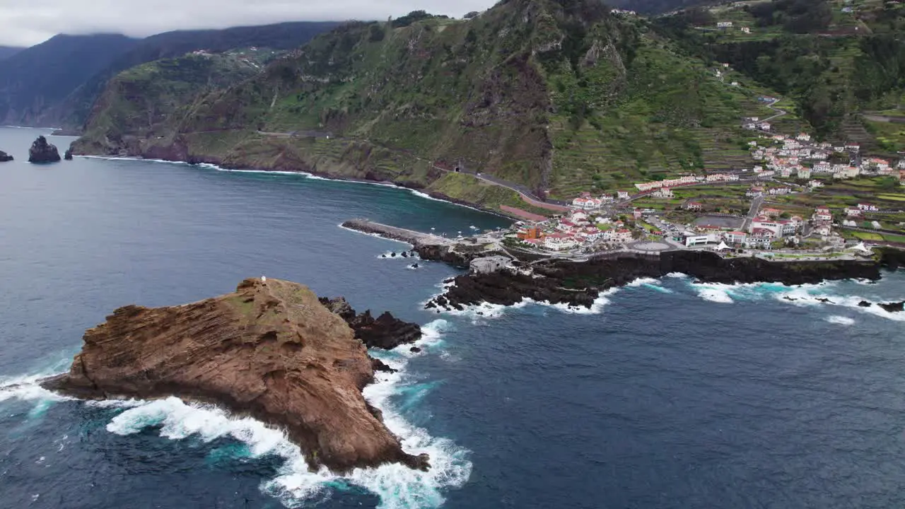 Small town near coast in Madeira drone aerial Portugal