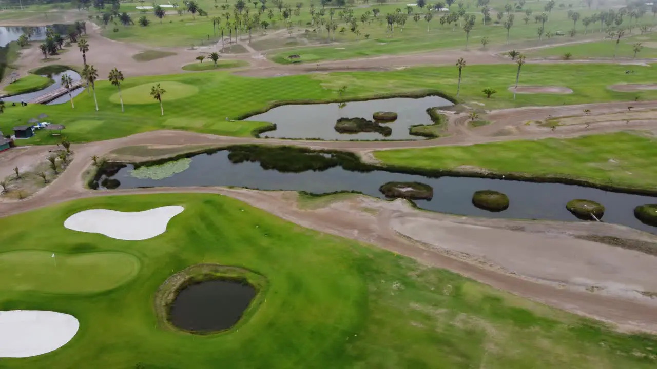 Drone video of a golf course on a foggy and cloudy day