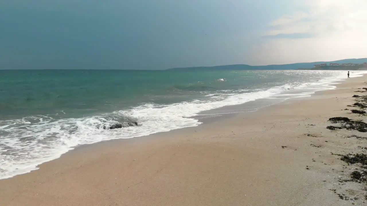 Parallax movement with drone around seashore and dark cloudy sky in Sozopol Bulgaria