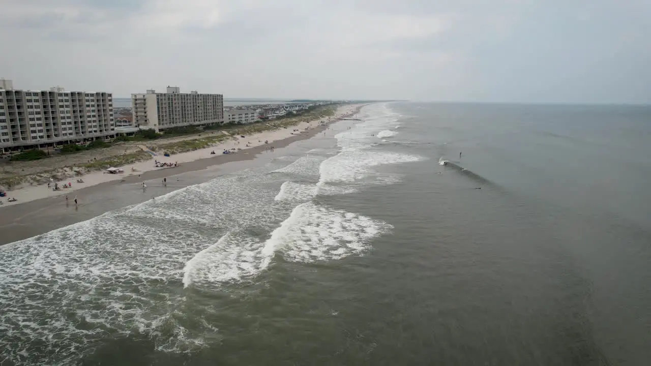 Jersey shore drone beach ocean flyover overcast summer day