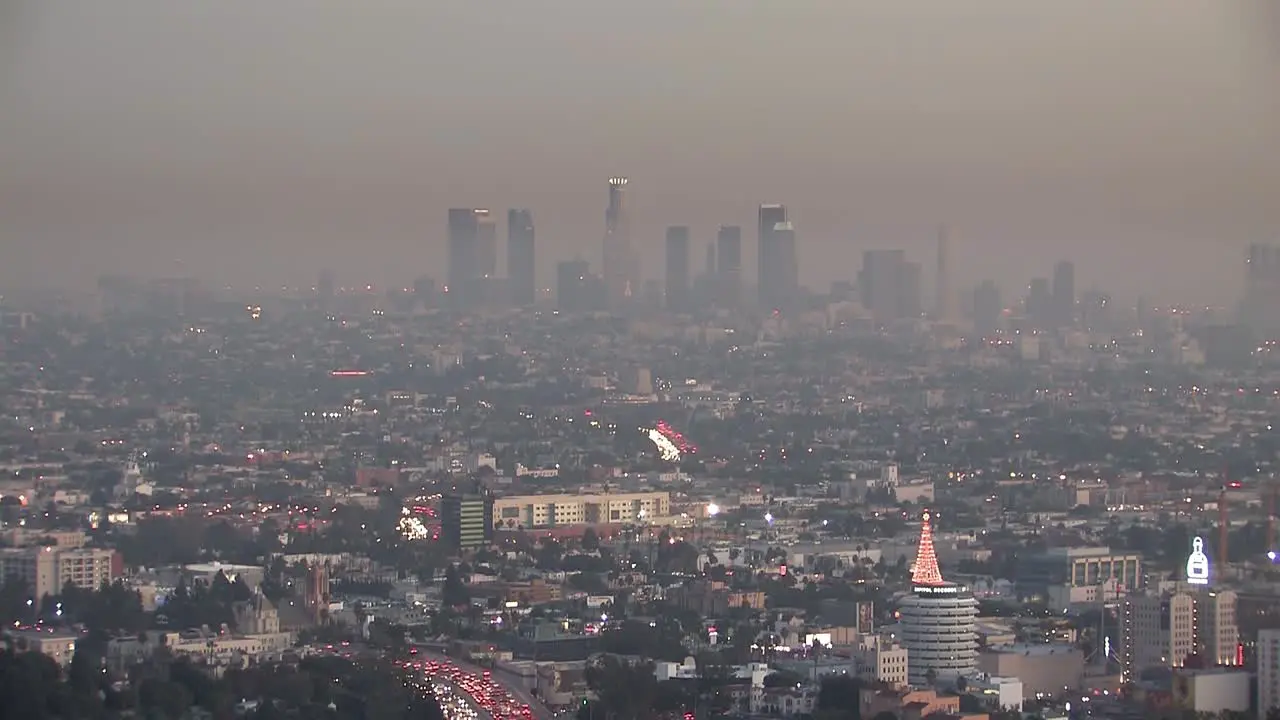 Panorama or long shot of downtown Los Angeles in the evening with smog a few weeks before Christmas California USA