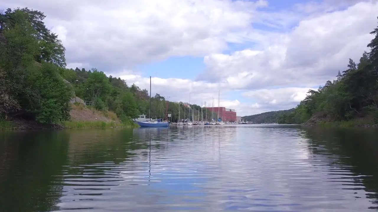 Fast Low to the ground drone view of lake with recreational boats