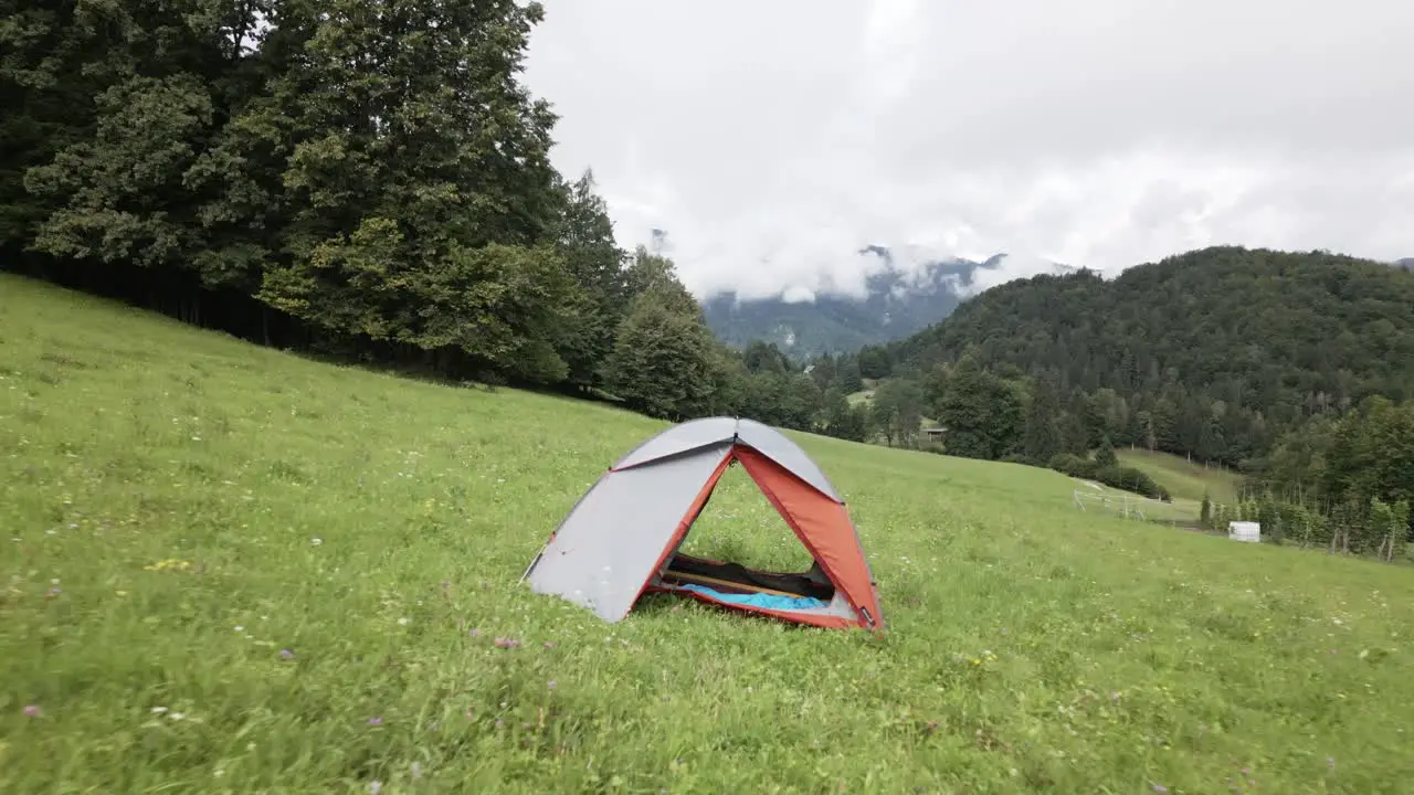 tent on a meadow in the mountains