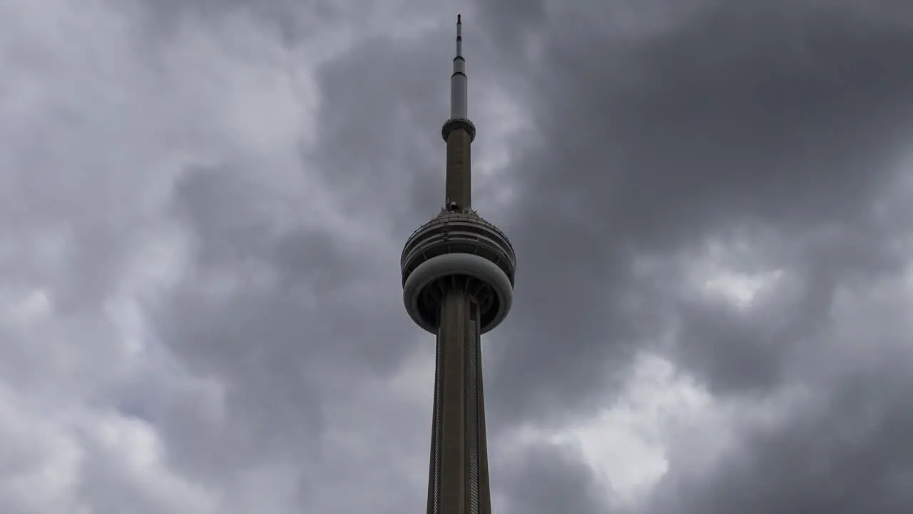 Timelapse of overcast sky behind iconic CN Tower in Toronto