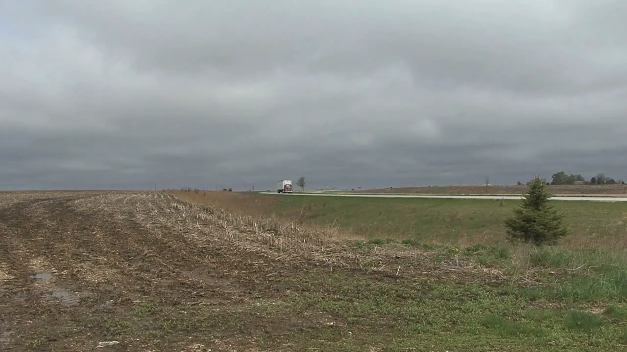 A highway past farmland on the plains