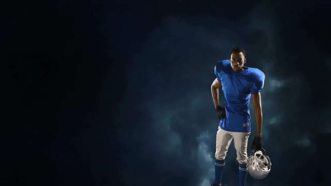 American football player on a stormy sky