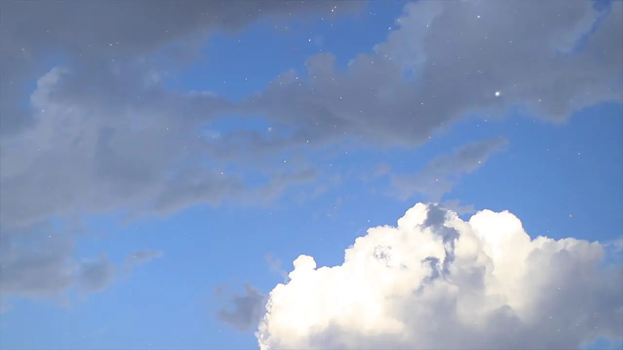 Colorful beautiful sky with few clouds in it and a raindrops that sparkle from the sun