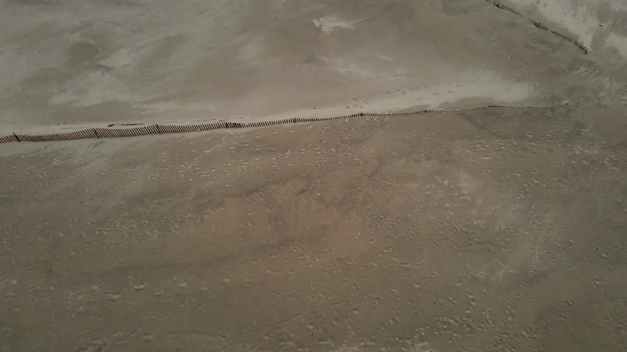 Gimbal tilt up to 90 over a beach during early and overcast weather