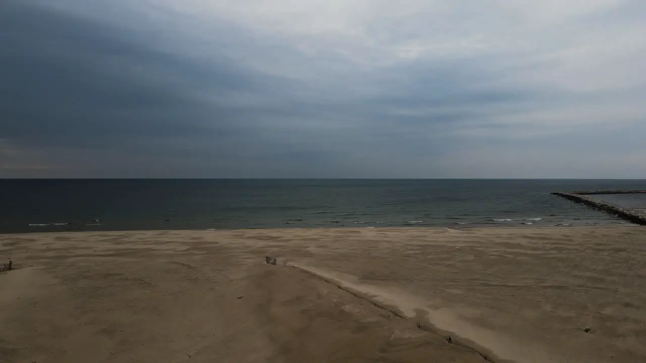 Simple drone movements in isolation over a stormy beach