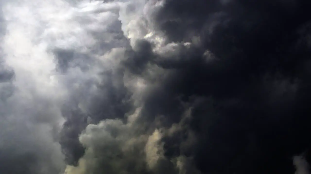 thick dark clouds with bolts of lightning in them