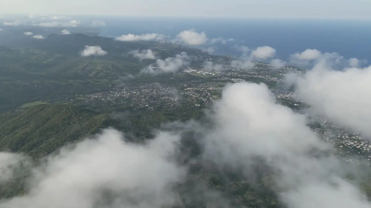 AERIAL Drone shot above the city of Puerto Plata through the clouds