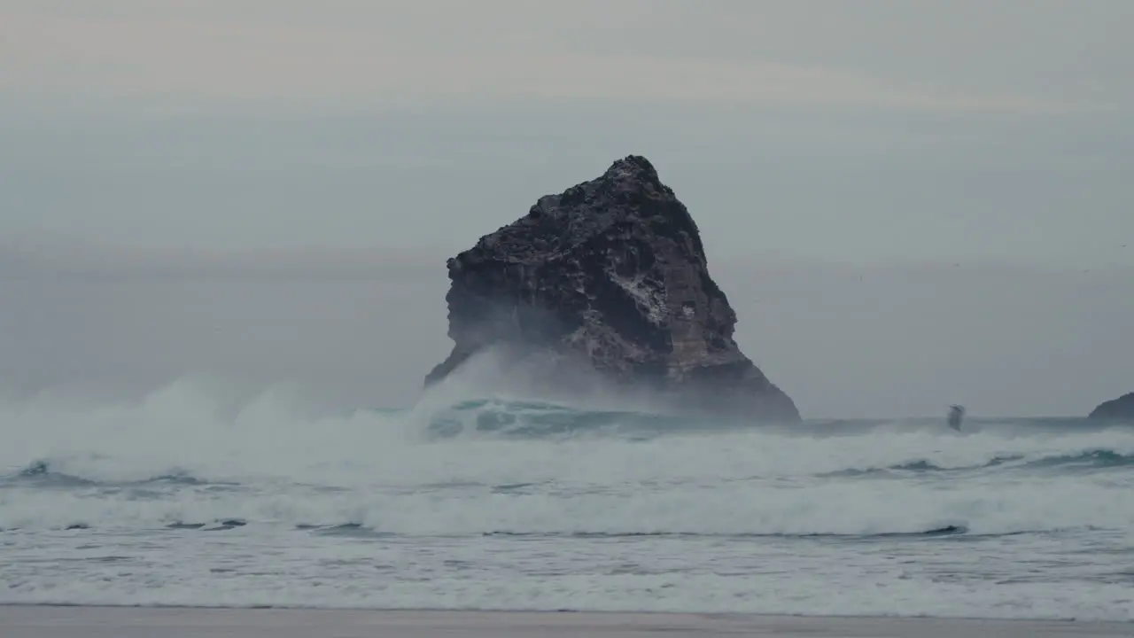 Powerful Waves Crashing On Lion's Head Rock In Sandfly Bay Near Dunedin New Zealand