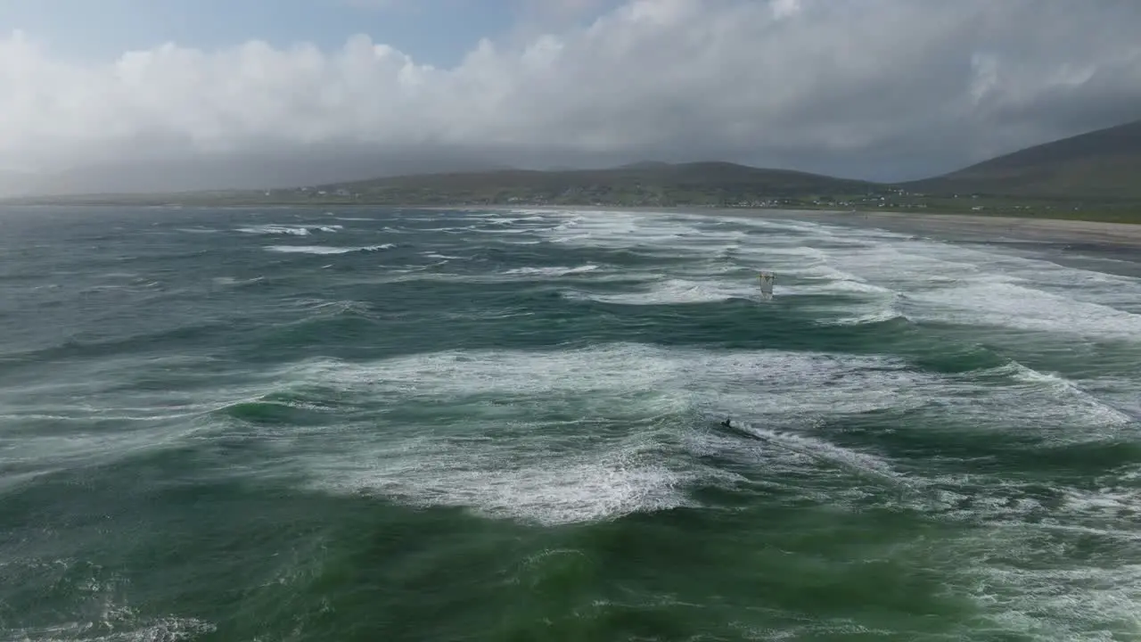 Kitesurfer braves tumultuous ocean at Keel Beach Achill Island