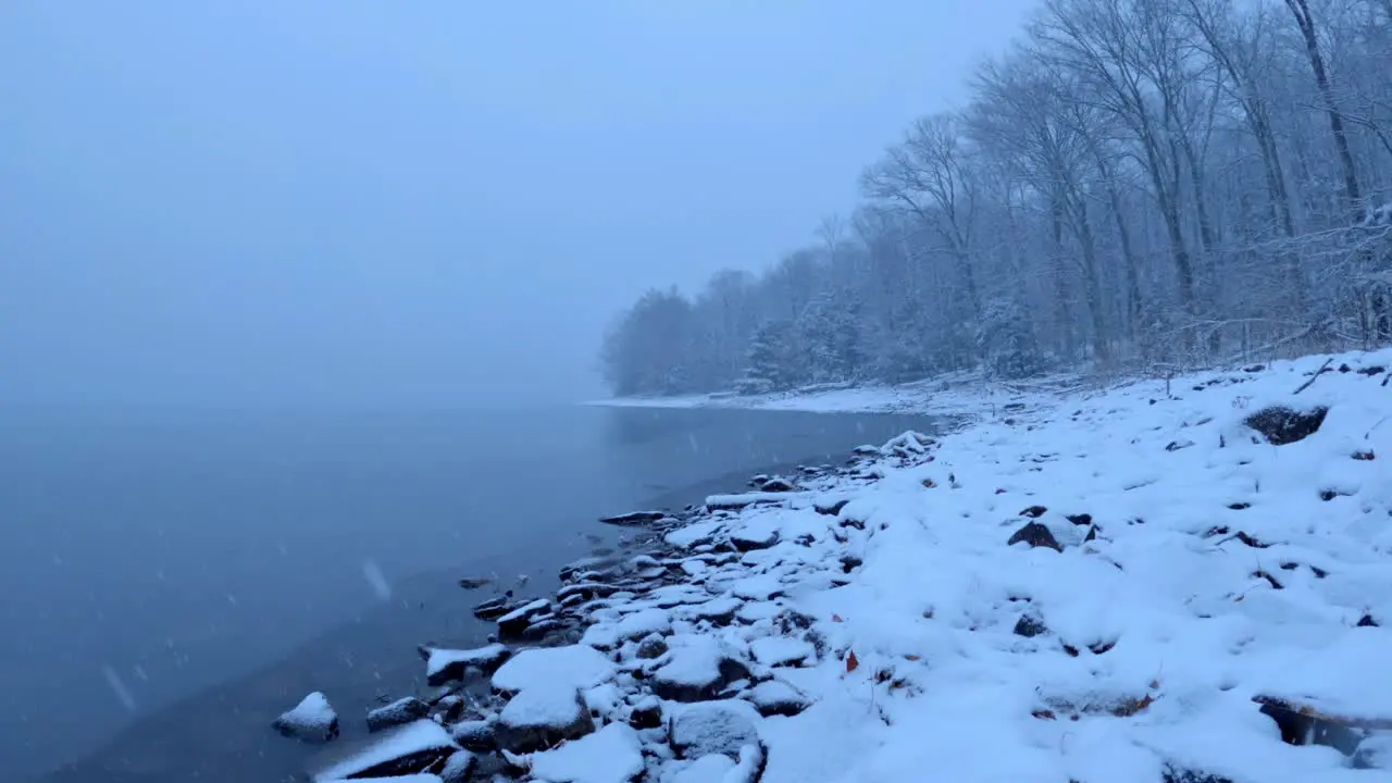 Beautiful snowfall timelapse on a pristine mountain lake