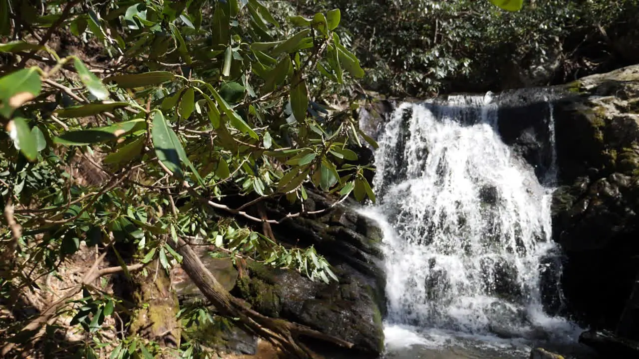 Slow motion wide shot of mountain waterfall shot at 180 frames per second