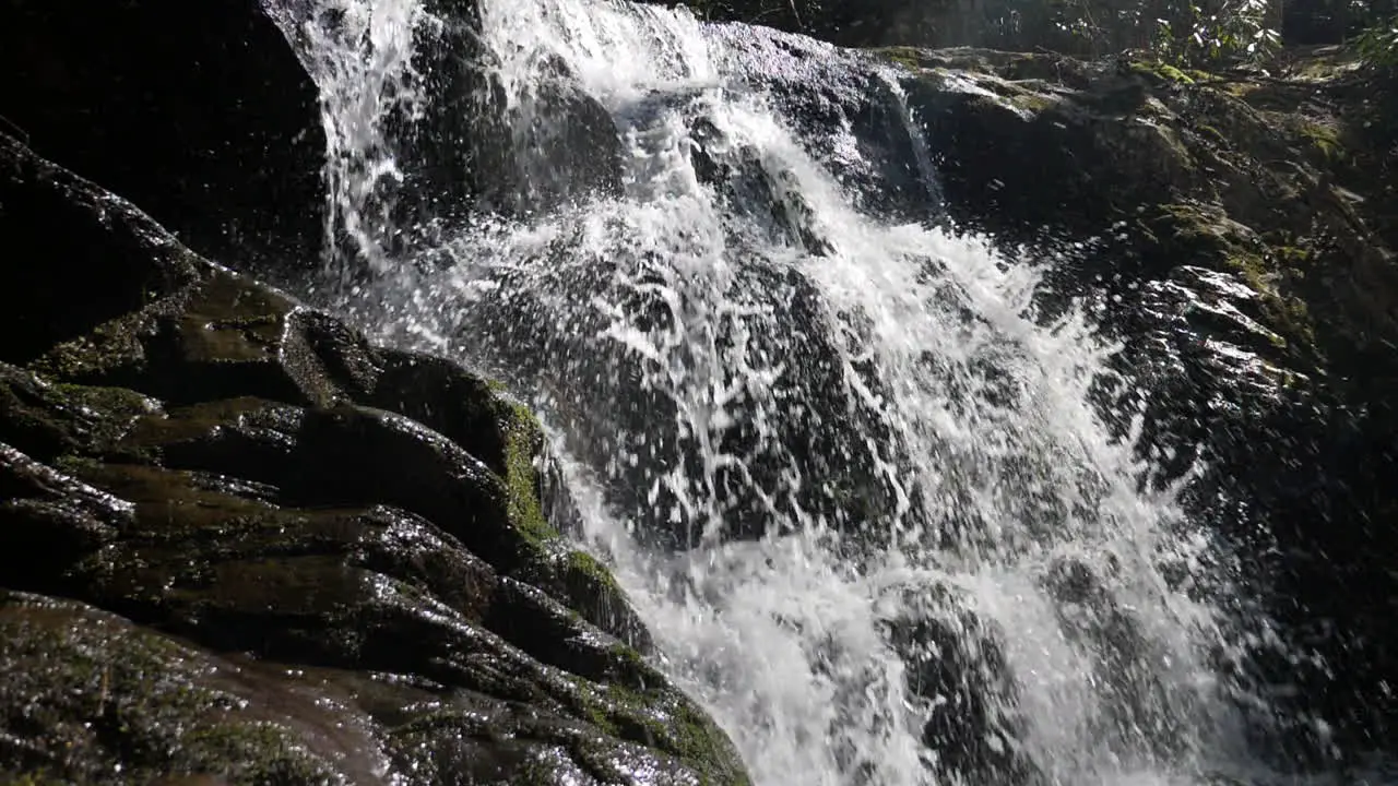 Brilliant slow motion of water plunging from a waterfall at 180 frames per second