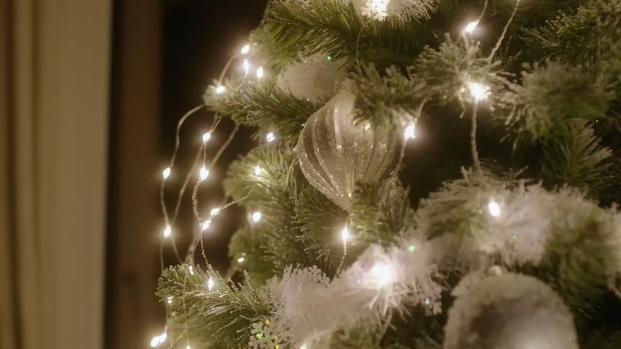 Christmas ornament on a beautiful Christmas tree parallax in slow motion