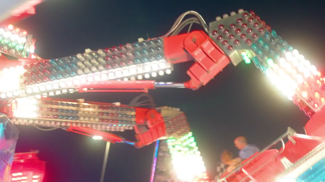 Bright lights and thrills at the amusement park on a warm summer evening