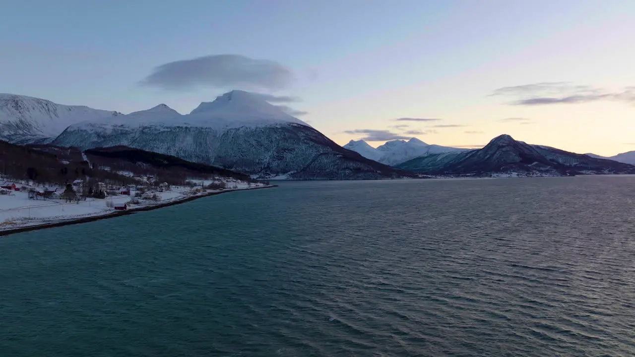 Picturesque Landscape Of Sea Snowy Mountain And Arctic Village At Polar Night In Northern Norway