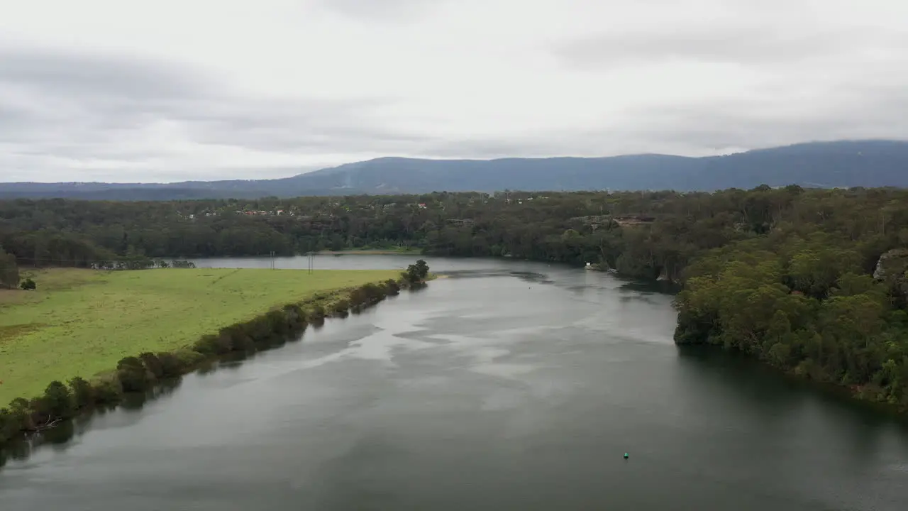 Aerial drone shot flying up the Shoalhaven river on a stormy day near Nowra NSW Australia