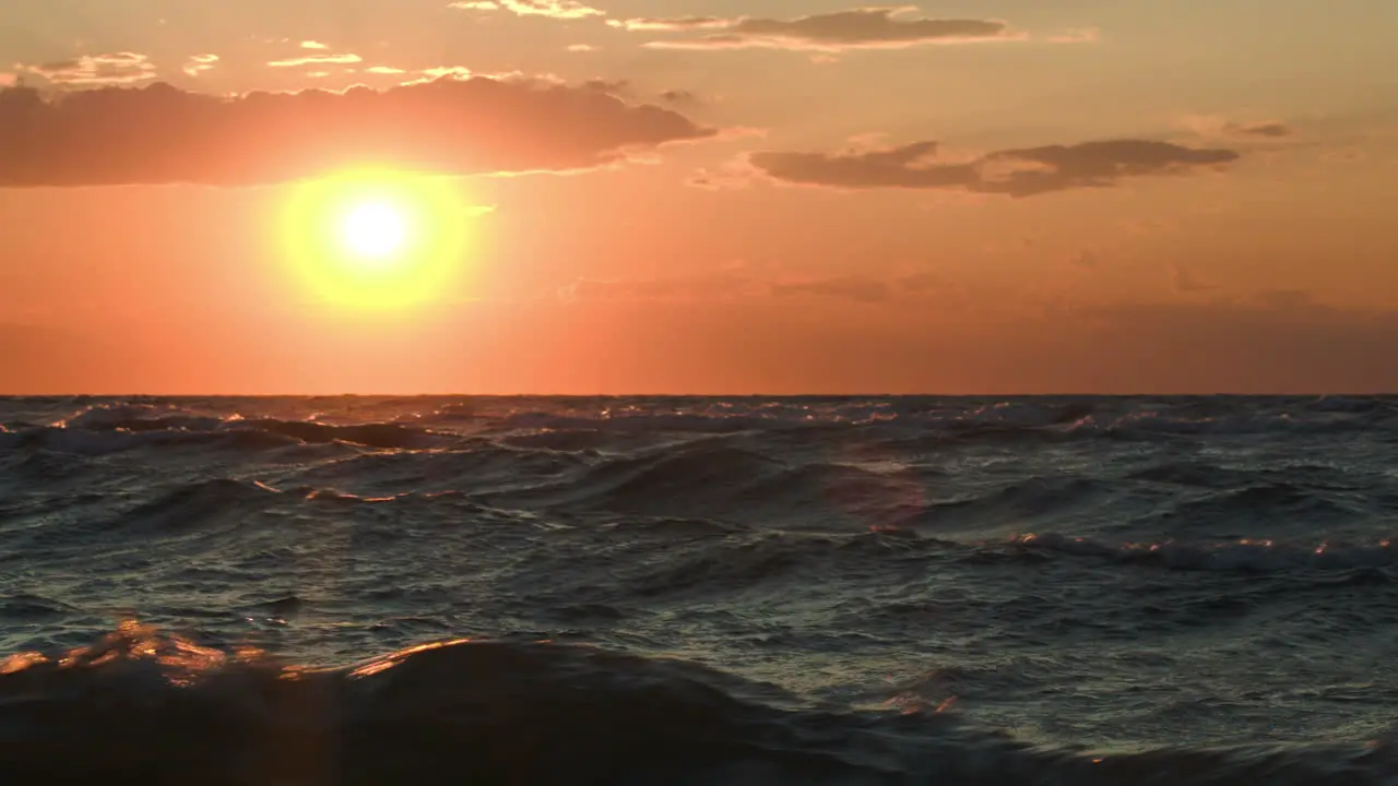 Golden sunset over rough sea