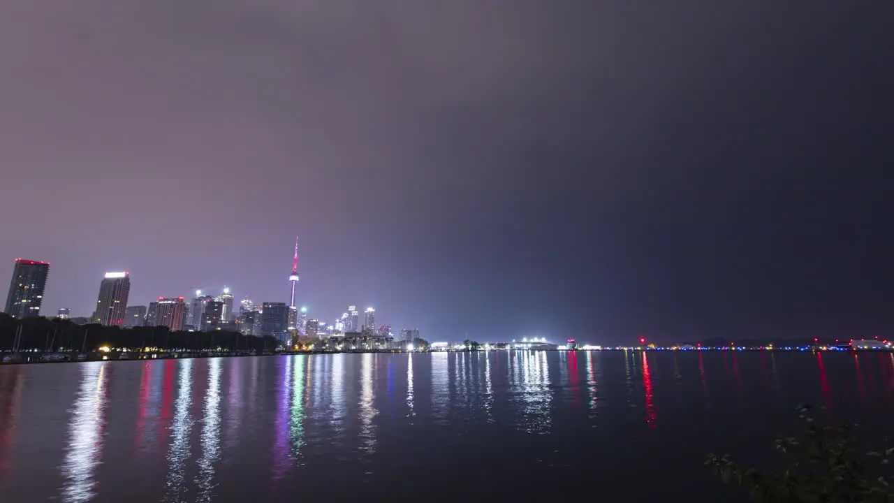 Timelapse of rainy overcast sunrise with the downtown Toronto skyline across the water from Trillium Park