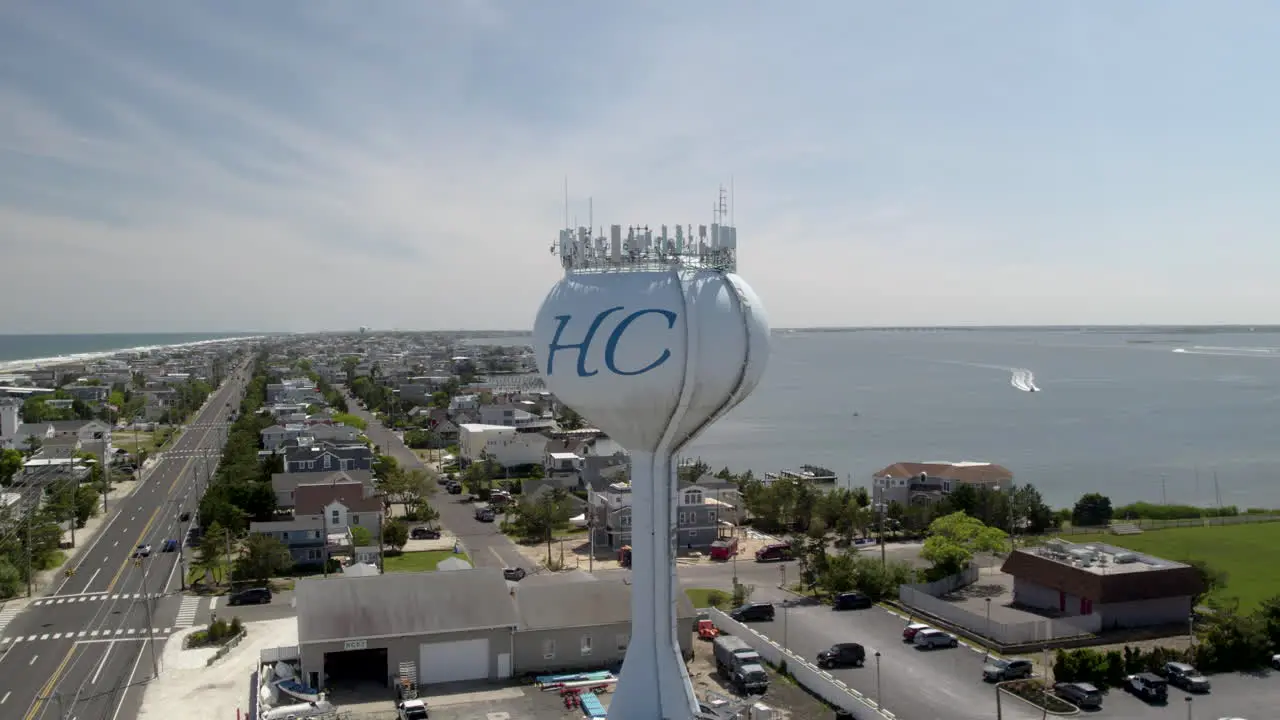 Skinny Island Beach Town with both bayside and ocean visible Water Tower with Boats in Background