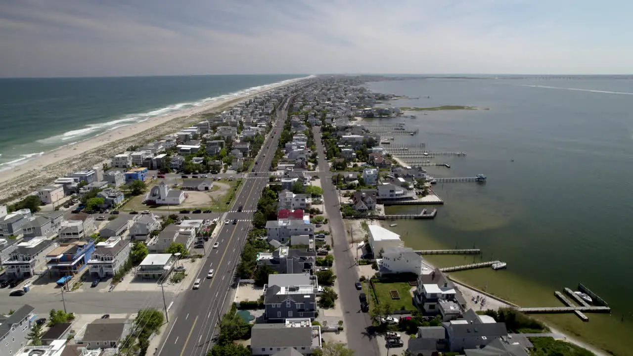 Skinny Island Beach Town with both bayside and ocean visible Aerial shot revealing water tower