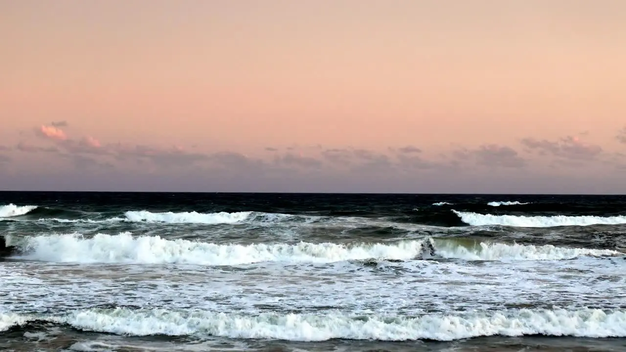 Pastel Dawn Skies Above Foamy Ocean Surf The Quietude of Nature at Daybreak