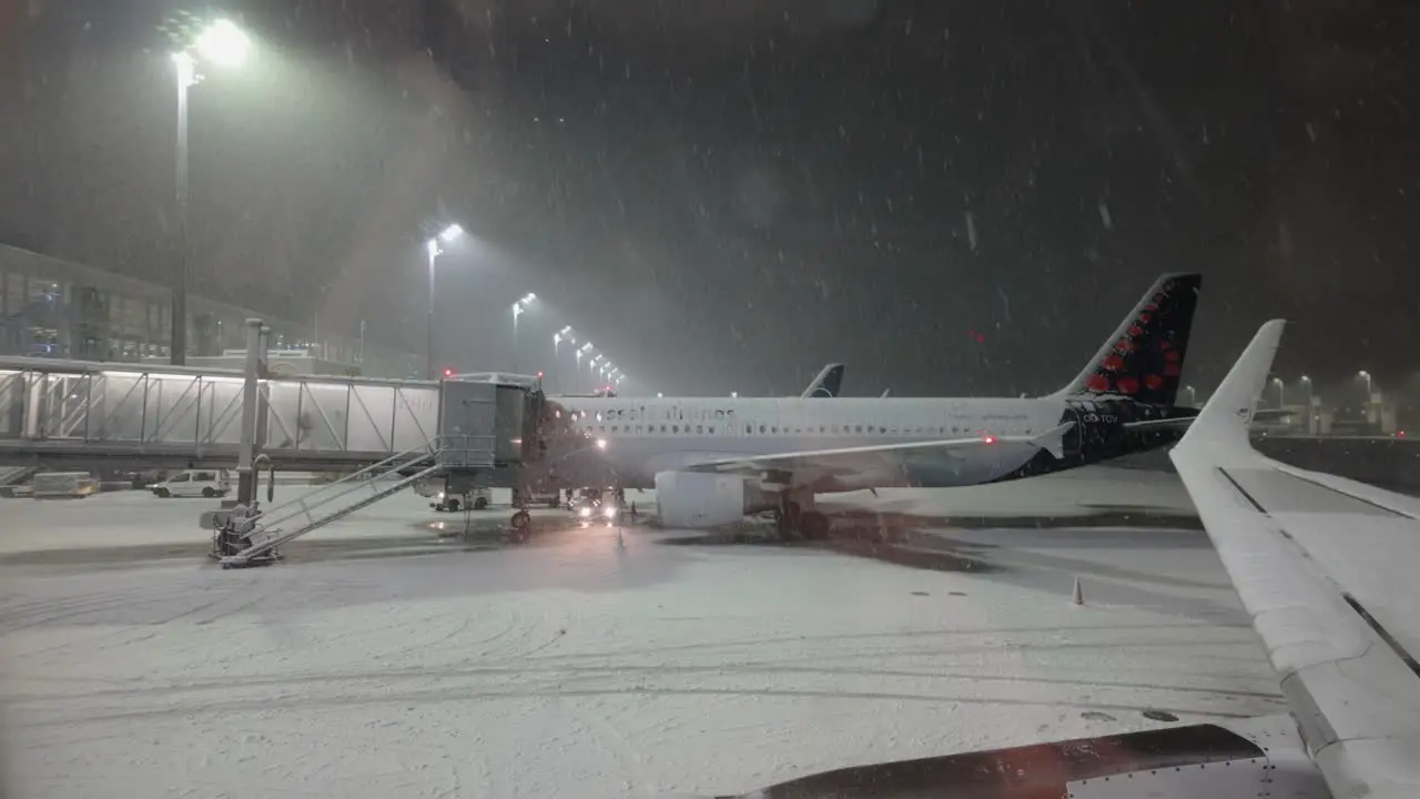 Snow Falling At Night In Munich Airport During Winter In Germany