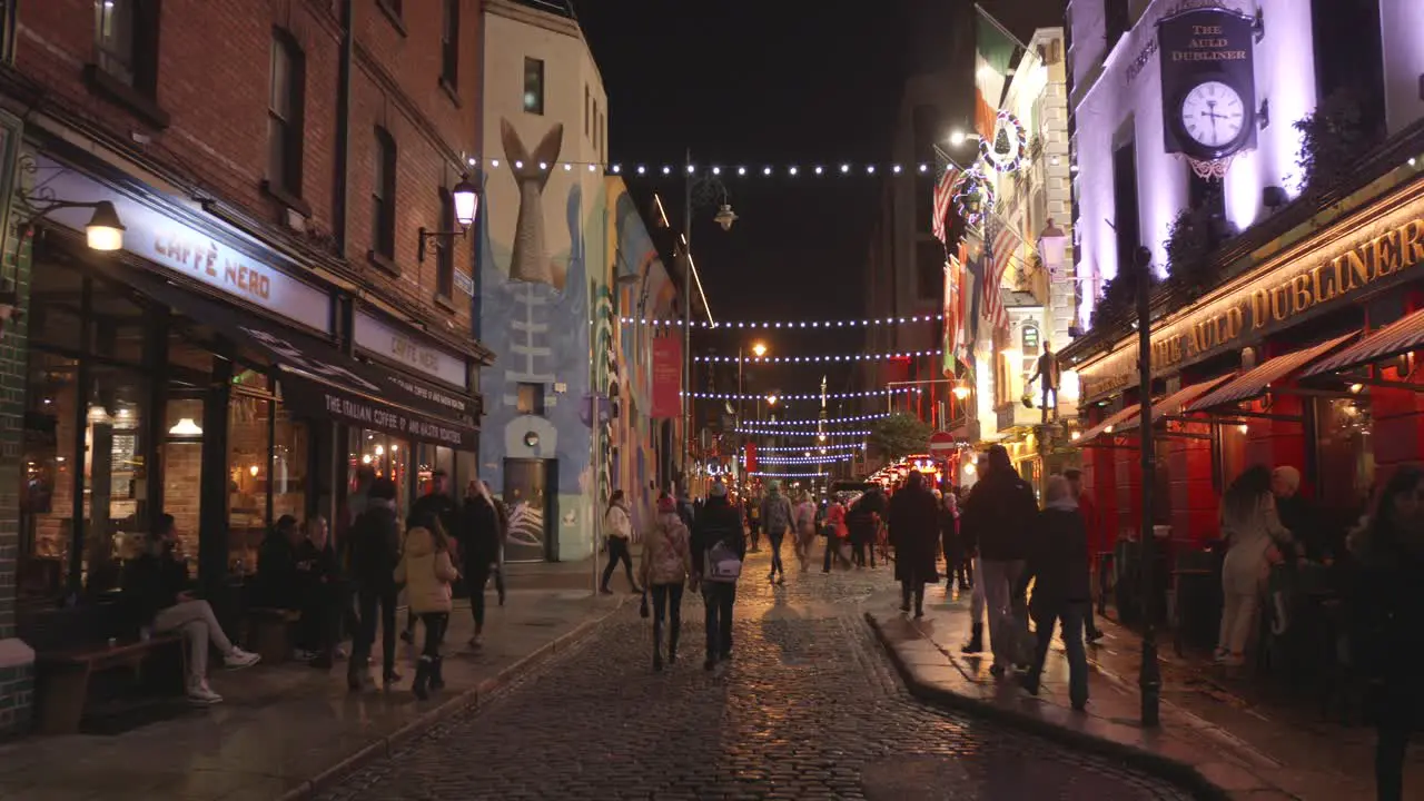 Tourists in the city center and pub alley in the christmas time during night