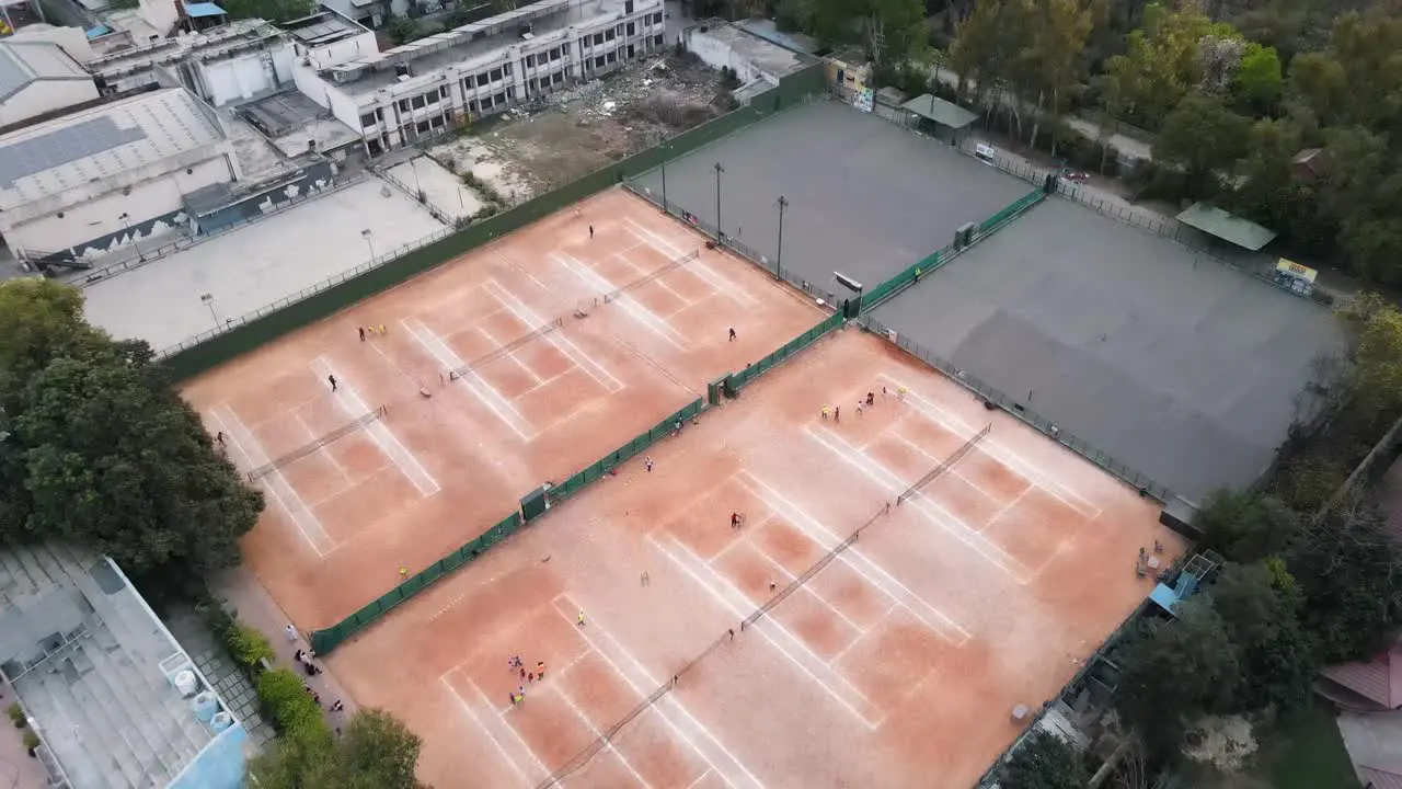 4K Drone Shots of a Lawn Tennis Ground during Sunset in an Indian City New Delhi above trees and houses beautiful light punjabi bagh club posh colony