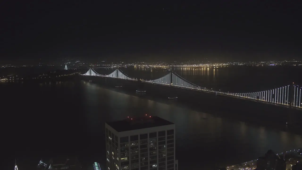 Aerial view of a lit up city bridge