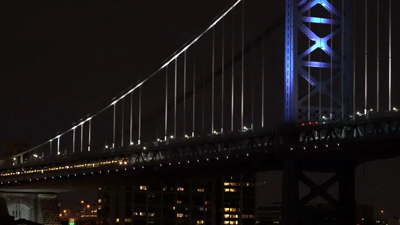 The metro crossing the Ben Franklin Bridge in Philadelphia at night with the lights shining-1