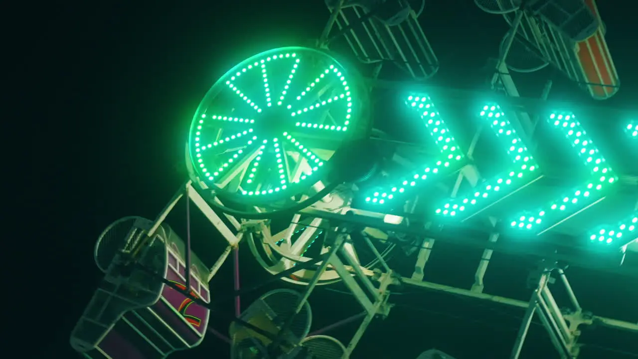 People enjoy a night time thrill on The Zipper at the CNE midway in Toronto