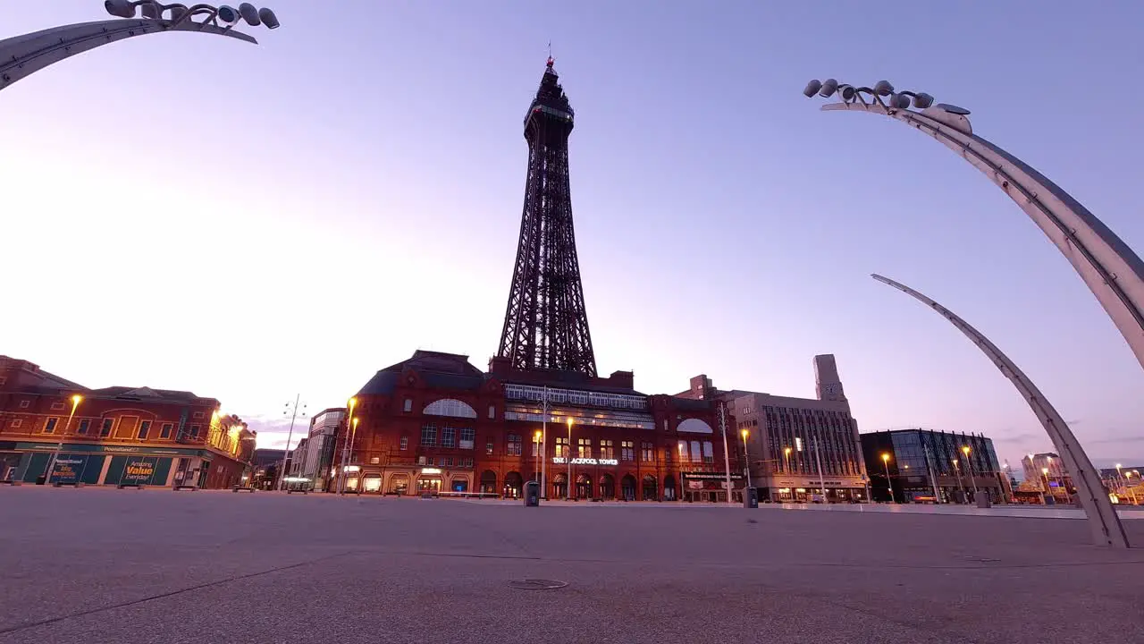 Blackpool tower British tourist attraction seaside promenade at morning sunrise timelapse