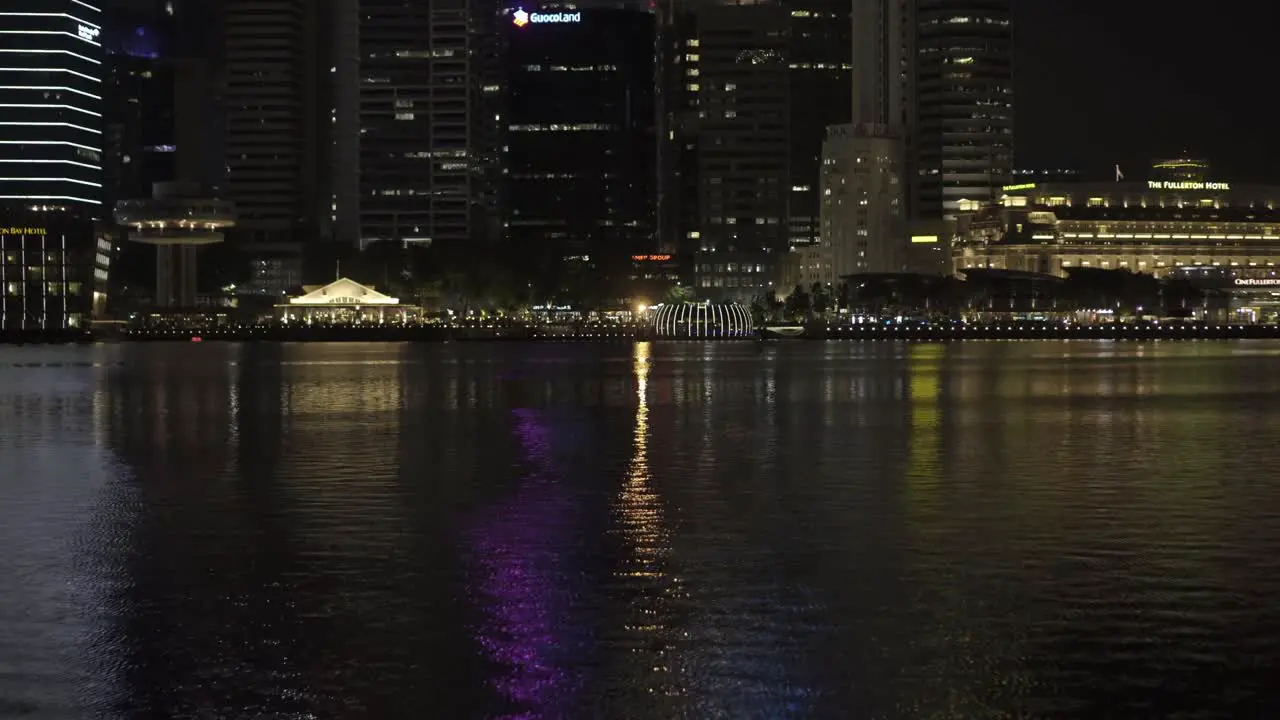 View of Singapore Skyline across Marina Bay at night with beautiful sky along the river