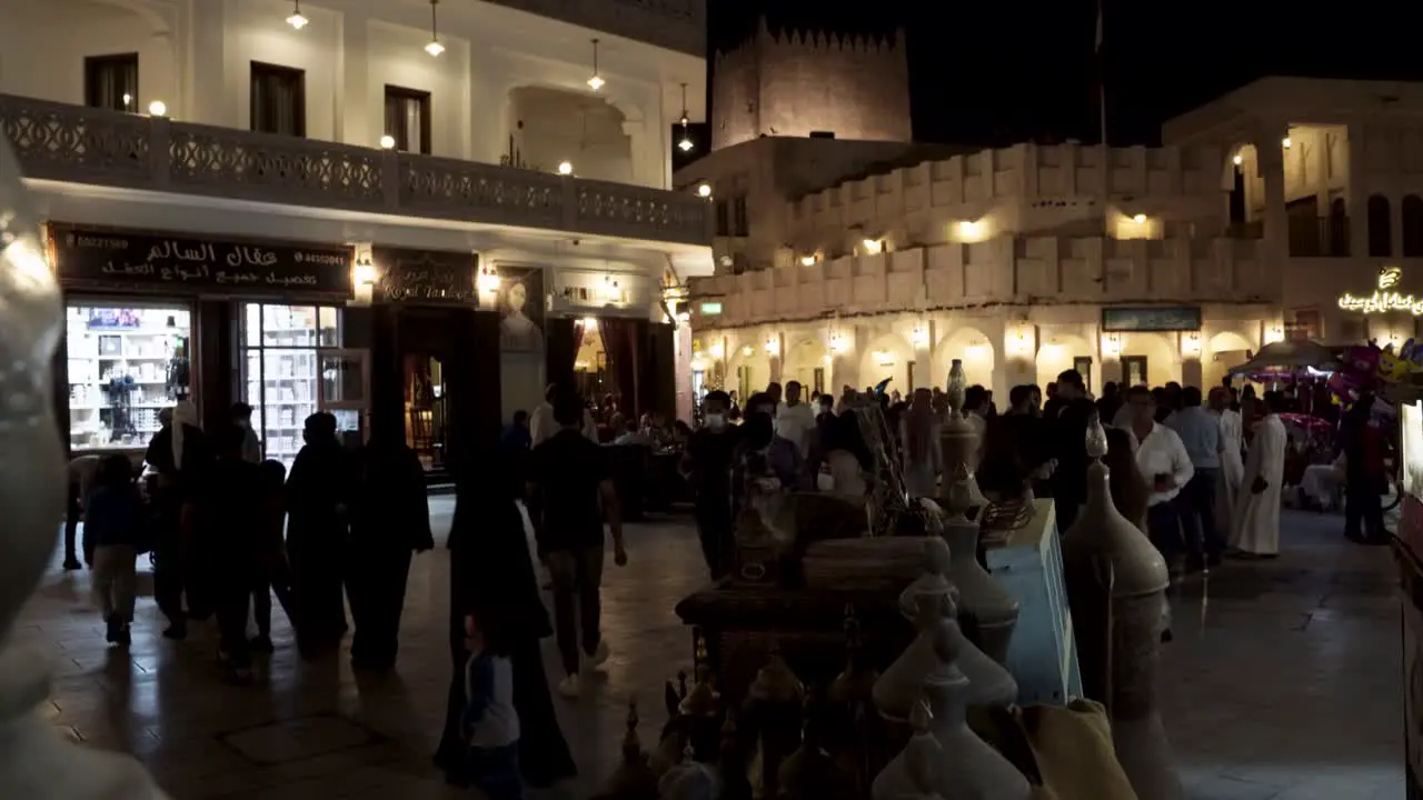 Nighttime at the central souk in Doha Qatar with tourists and locals shopping