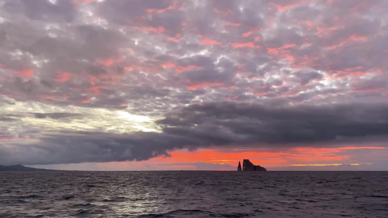 The Sun Sets Over The Leon Dormido Rocky Formation In The Galapagos