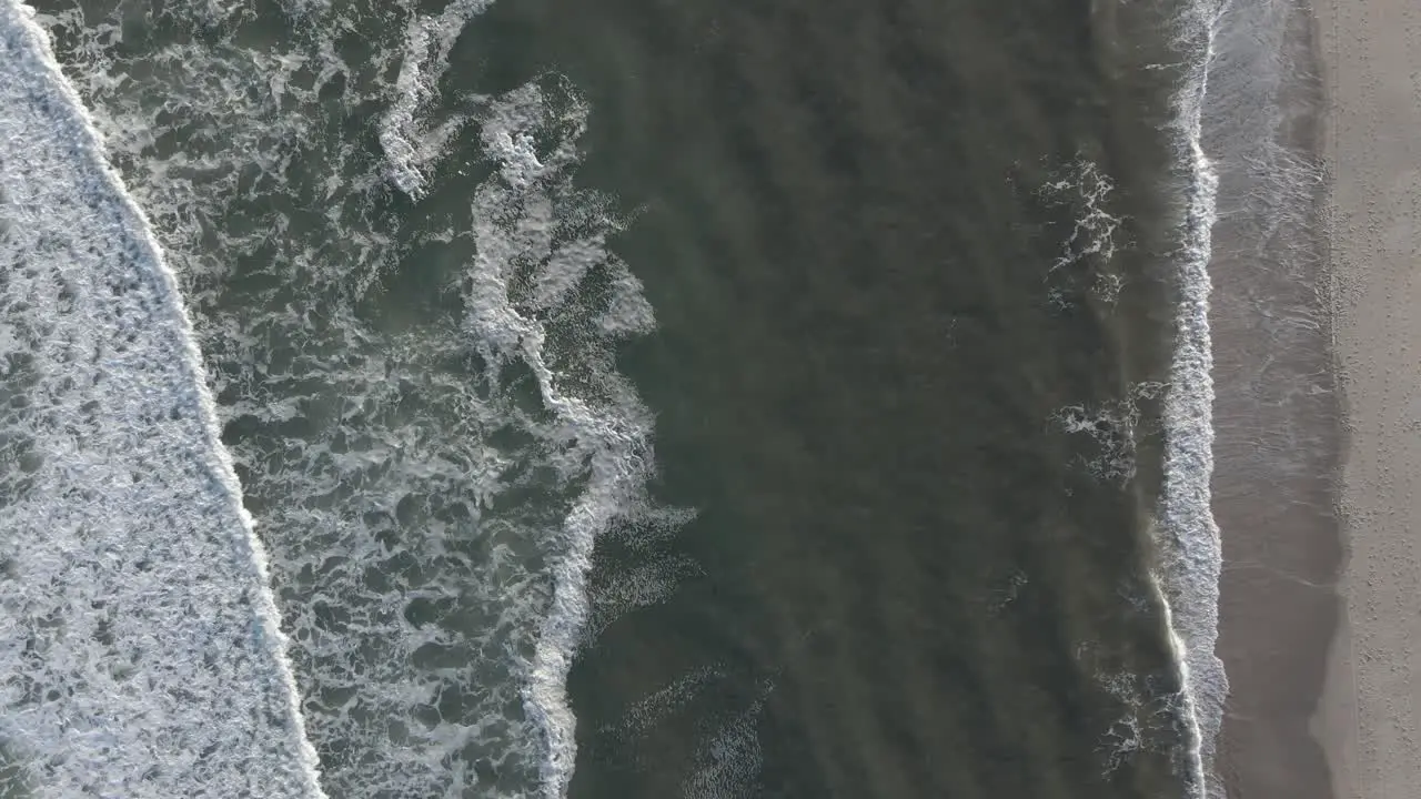 Wonderful View Of The Ocean Waves Splashing To The Shore Aerial Shot