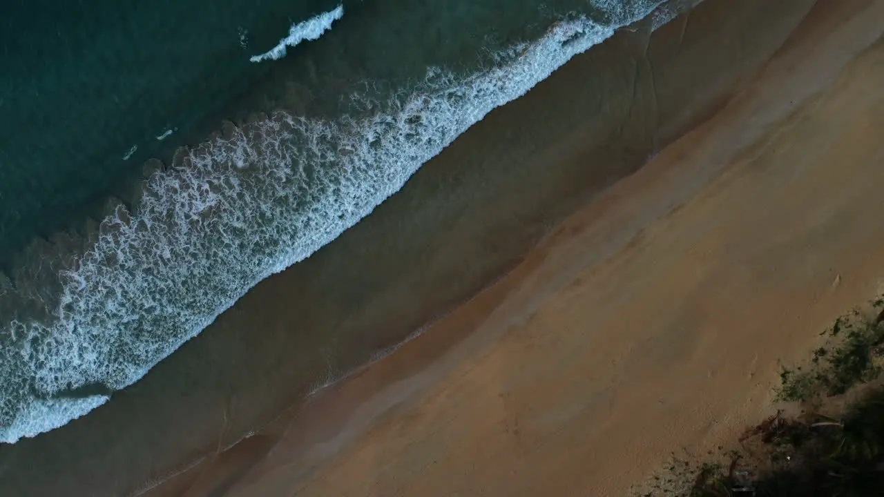 Drone shot of waves on tropical beach in El nido Palawan