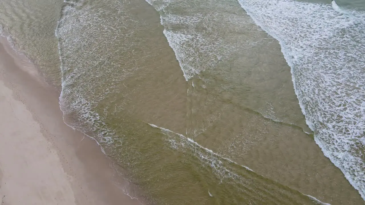 White Water Waves Rolling Gently Into The Perfect Sands Of Kingscliff Beach In New South Wales Australia aerial top down shot