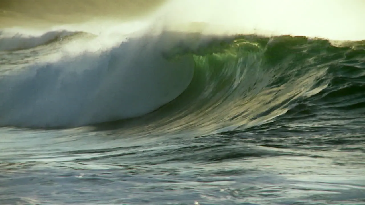 Large waves as they crest and break in slow motion 1