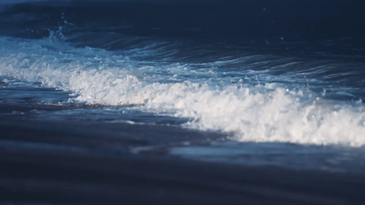 The powerful waves break on the sandy Ersfjord beach