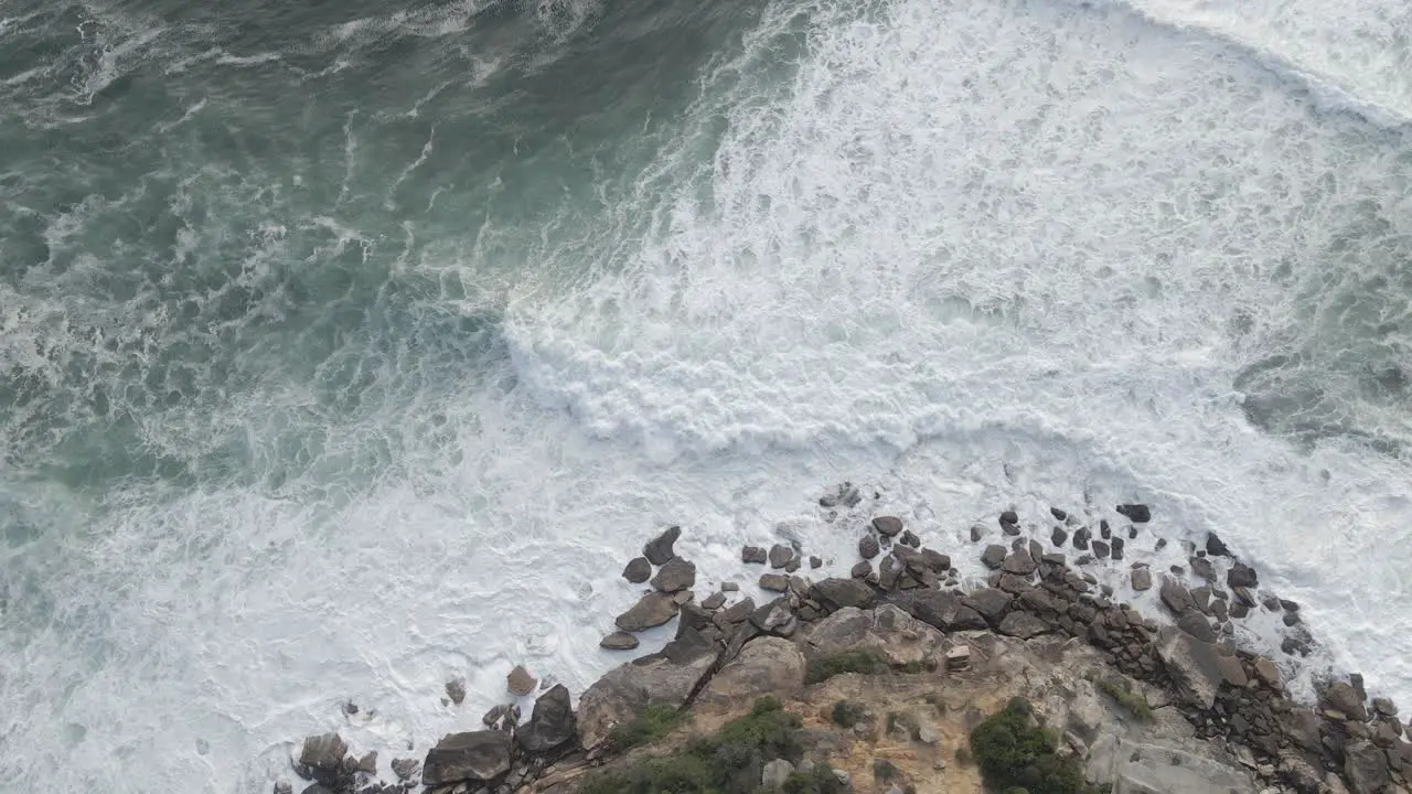 Top down View Of Foamy White Waves Breaking On Rock Cliffs Near Gordons Bay Eastern Suburb Sydney NSW Australia